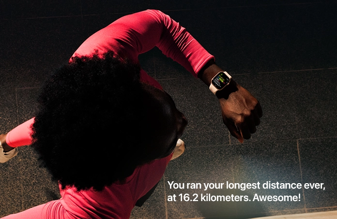 Photo of a man using his Apple Watch to track his run