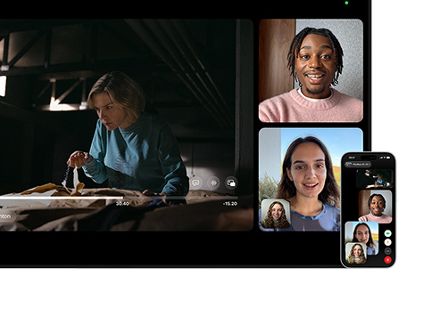Mac dan iPhone: Tampilan terpisah SharePlay di Mac, acara Apple TV diputar di kiri, petak FaceTime di kanan menampilkan tiga orang, iPhone yang dipasang di samping Mac digunakan sebagai Kamera Berkelanjutan