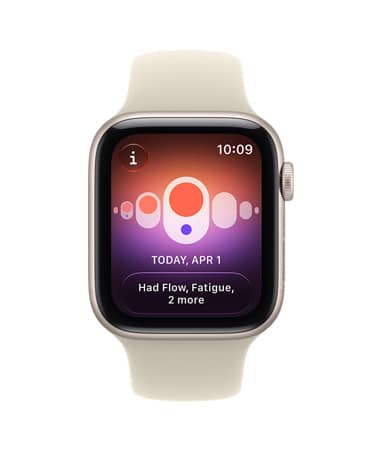 Apple Watch SE 3, aluminiumboett i färgen stjärnglans, på skärmen visas hälsamätning (cykelkoll), höger utsida, Digital Crown, sportband i färgen sand (ljusbrun)