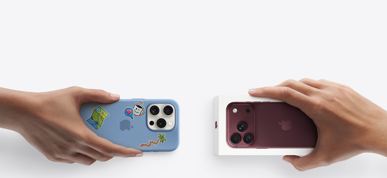 Side-by-side, hand holding iPhone 13 in silicon case with stickers on back exterior, trade-in with hand holding new iPhone box for iPhone 17 Pro