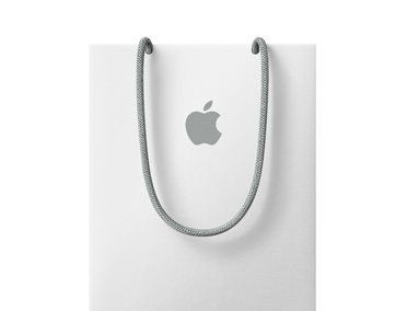 白色 Apple 購物袋，上方附近有 Apple 標誌