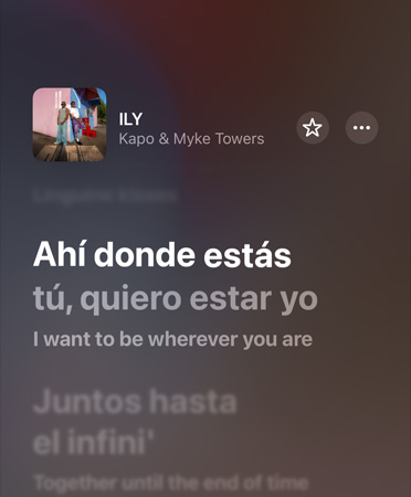 畫面顯示 Apple Music 正播放 Kapo & Myke Towers 的《ILY》，並提供西班牙文翻譯成英文的歌詞